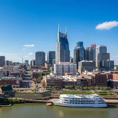 Nashville Skyline with a large white boat on the Cumberland River